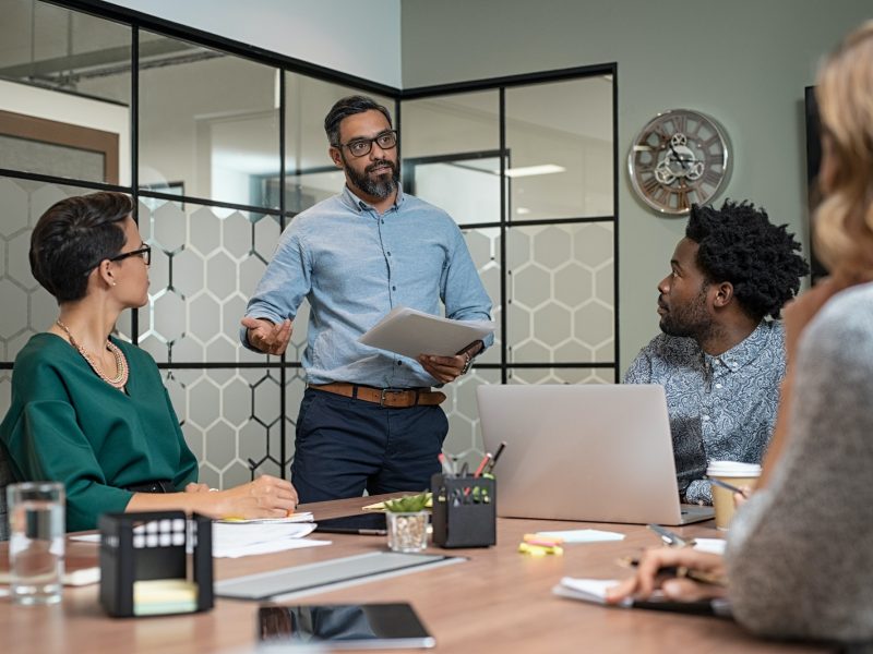 Man giving presentation in boardroom