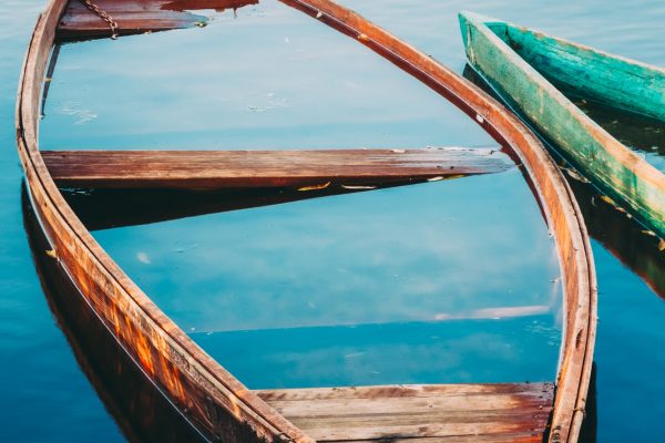 Old Sunken Wooden Fishing Boat In River. Belarusian Nature